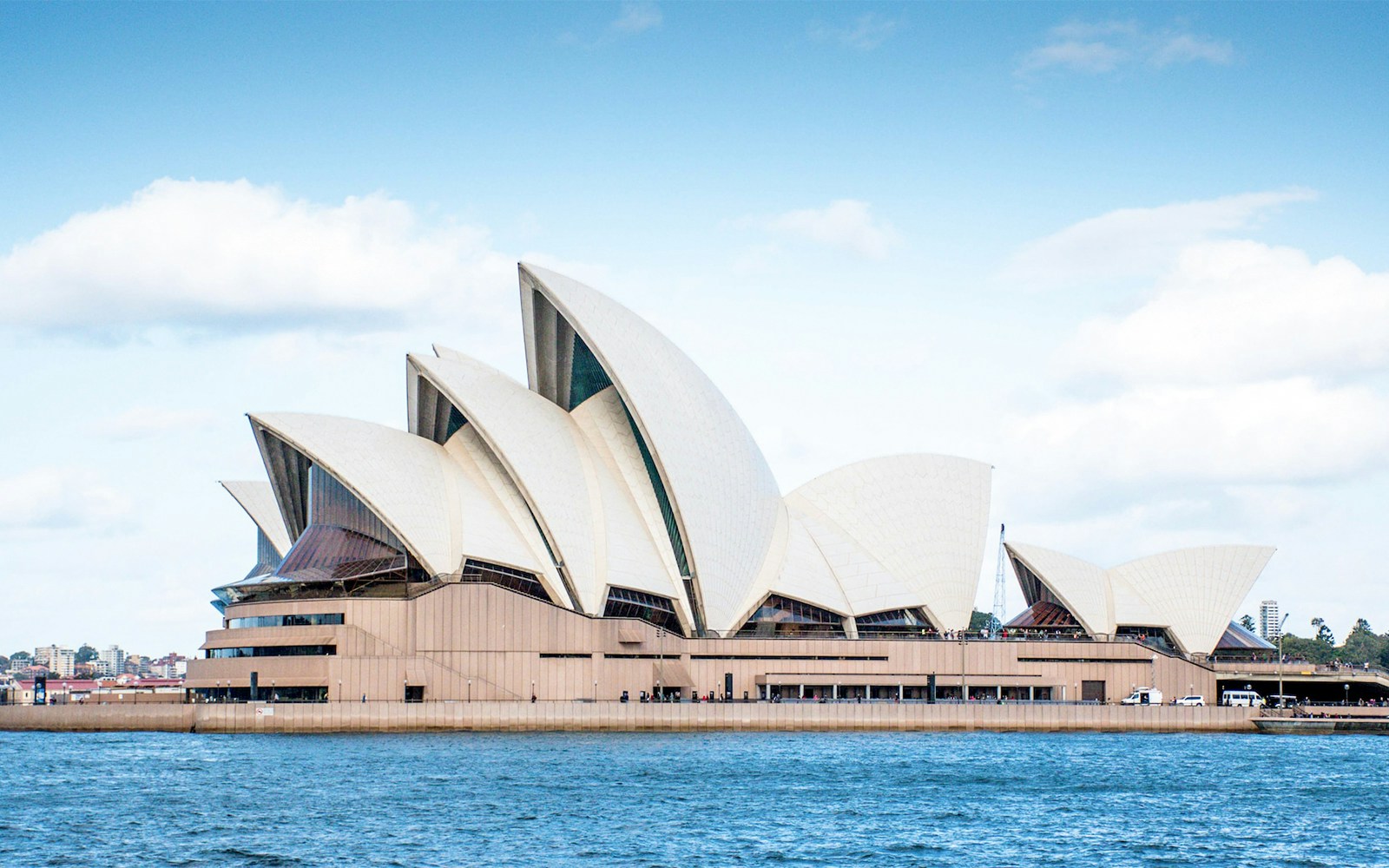 Sydney Opera House with iconic sail-like design by the waterfront.