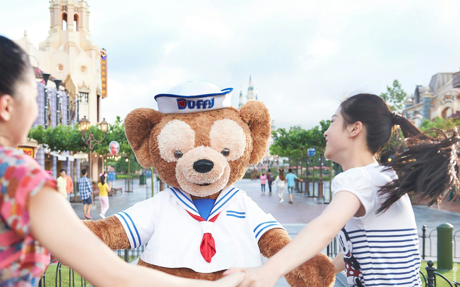 Duffy bear character greeting visitors at Shanghai Disneyland.