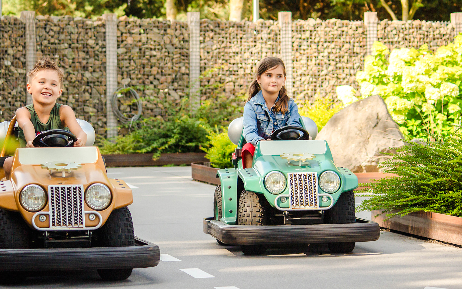 Kids driving mini cars at Wild West theme park in Slagharen.