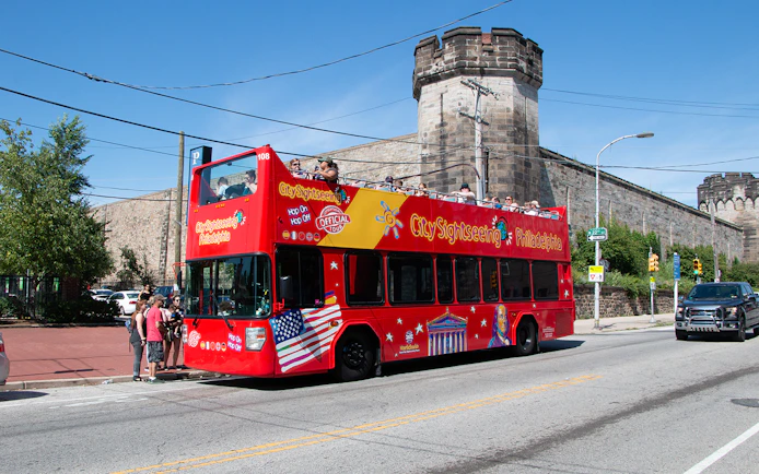 Open-top tour bus in front of Eastern State Penitentiary, Philadelphia.