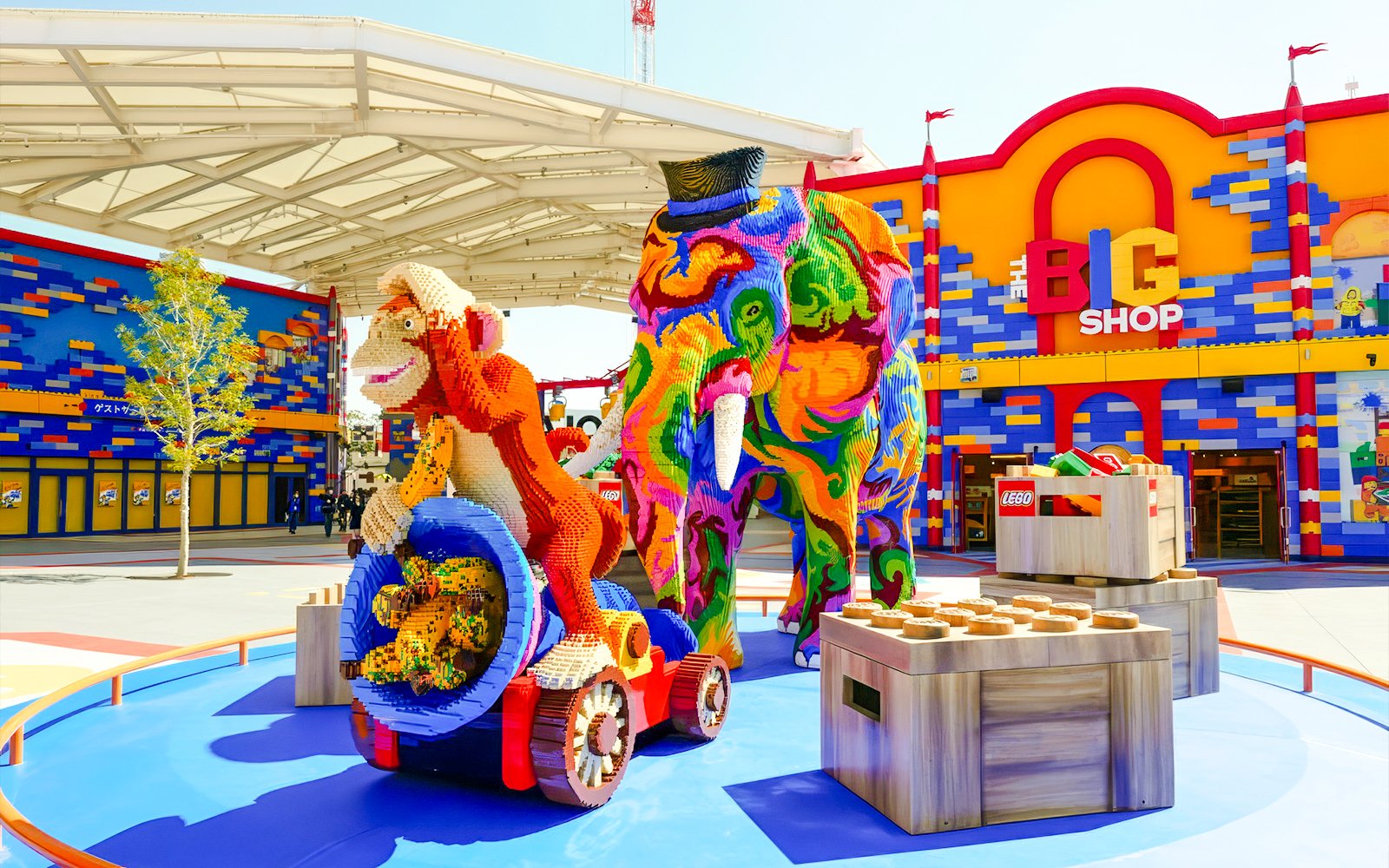 Colorful Lego sculptures of an elephant and monkey at Legoland Japan entrance.