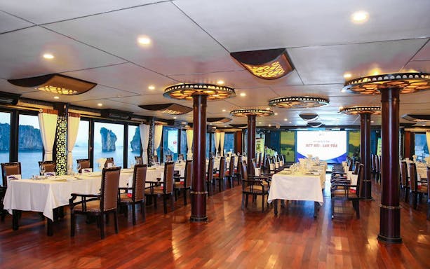 Restaurant interior on Starlight Cruise with ocean view in background, Starlight Cruise.