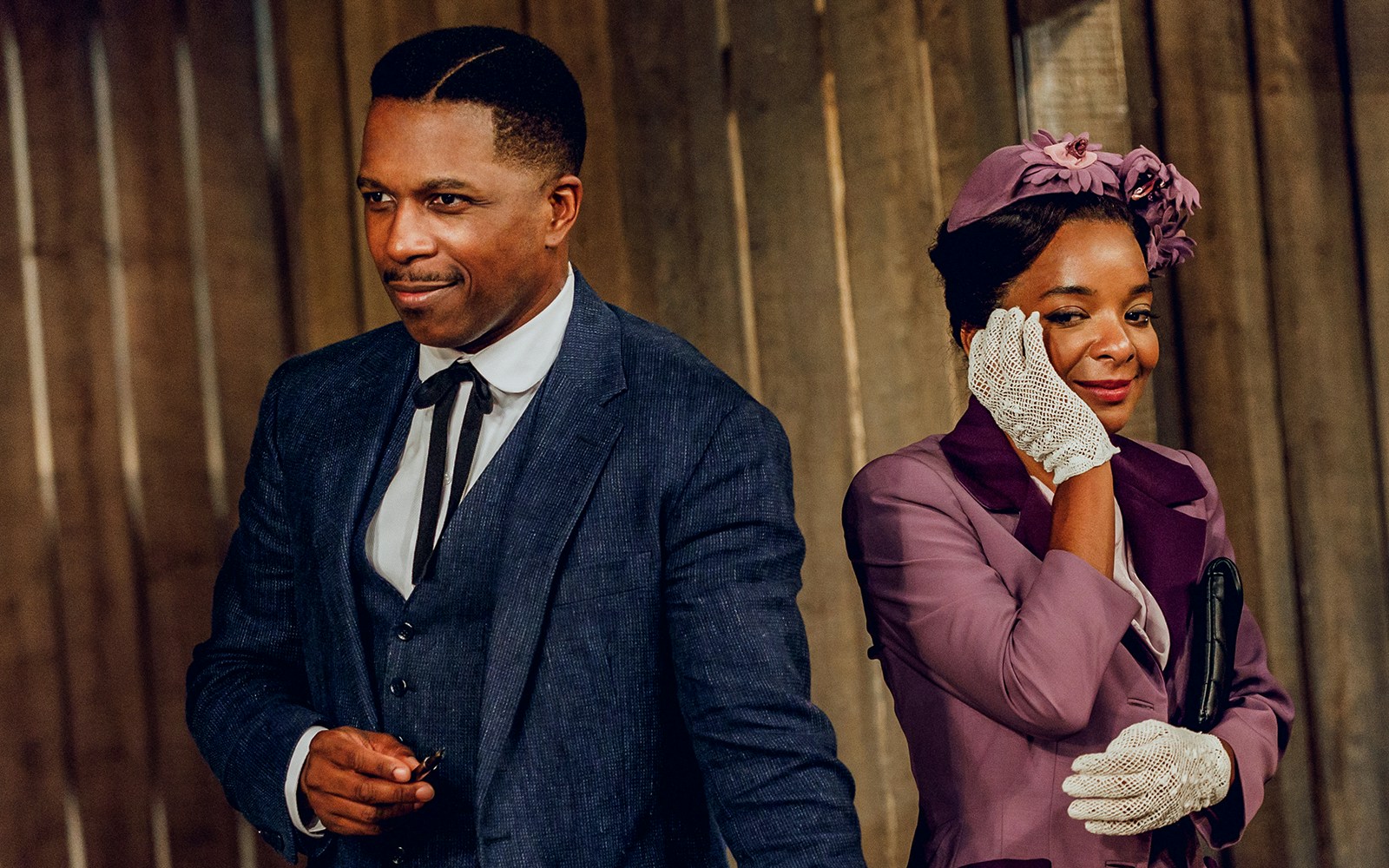 Two actors in period costumes from "Purlie Victorious: A Non-Confederate Romp" on stage.