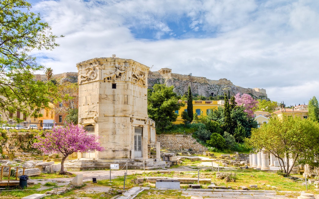 Tower of the Winds in Ancient Agora, Athens with Acropolis in the background.