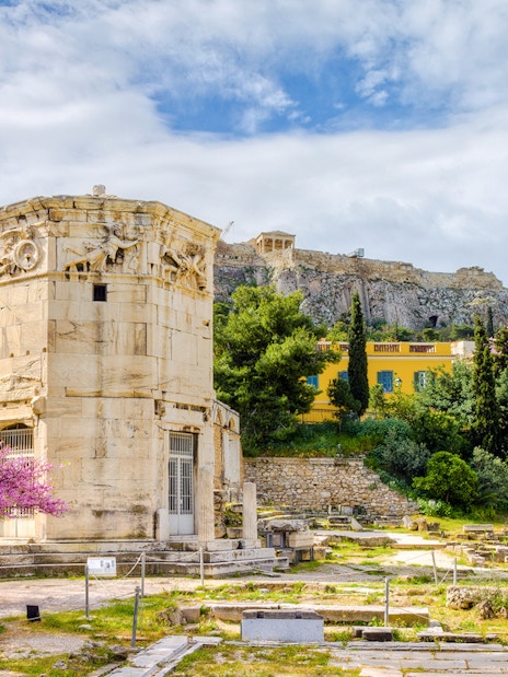Tower of the Winds in Ancient Agora, Athens with Acropolis in the background.