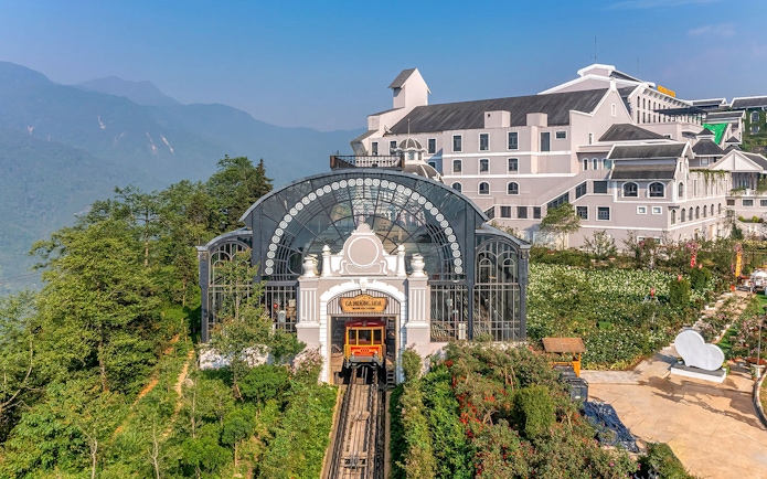 Sun World Fansipan Legend cable car station with mountain backdrop in Sapa, Vietnam.