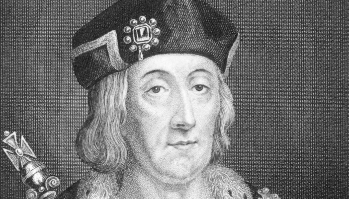 Engraving of Henry VII wearing a decorated hat and fur-trimmed robe.