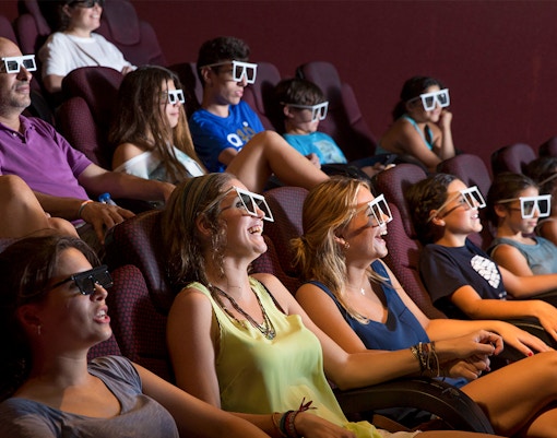 Visitors enjoying 4D cinema experience.