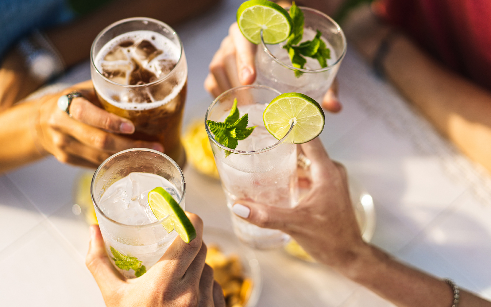 Diverse business professionals shaking hands in modern office, teamwork concept