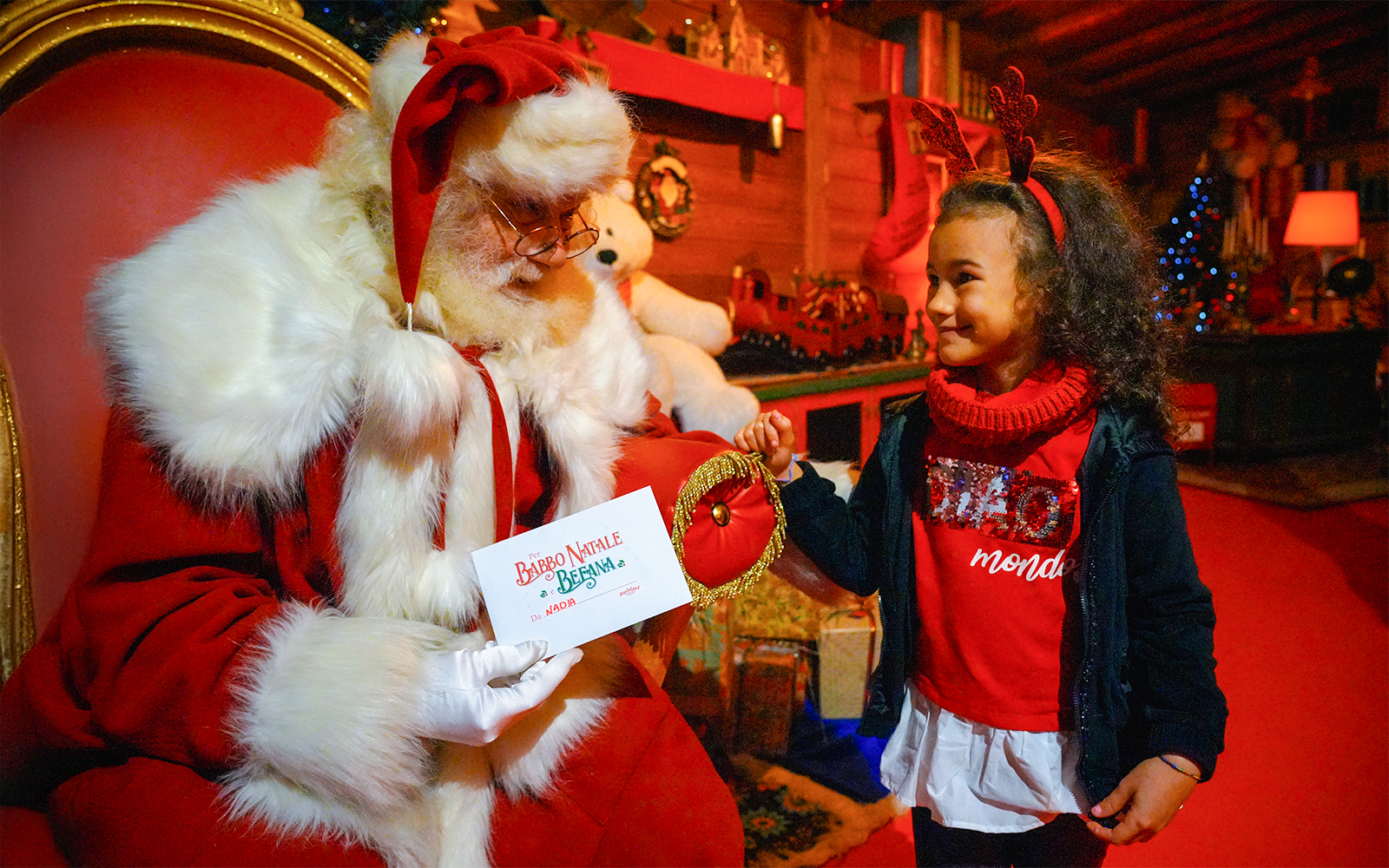 Kids meeting Santa Claus at Gardaland Park.