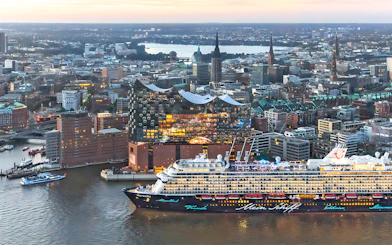 Aerial view of Elbphilharmonie and cruise ship in Hamburg, Germany at sunset.