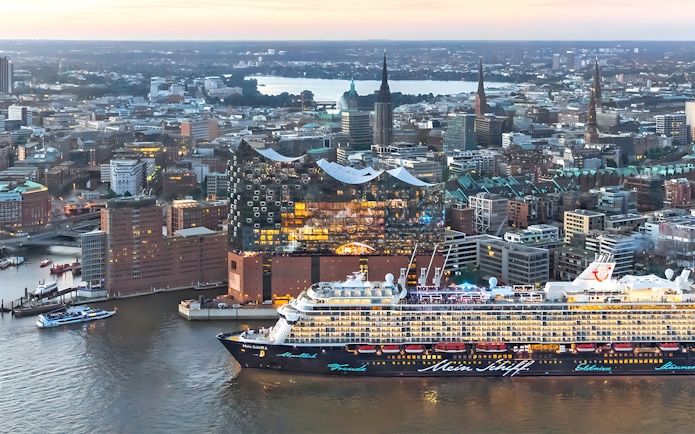 Aerial view of Elbphilharmonie and cruise ship in Hamburg, Germany at sunset.