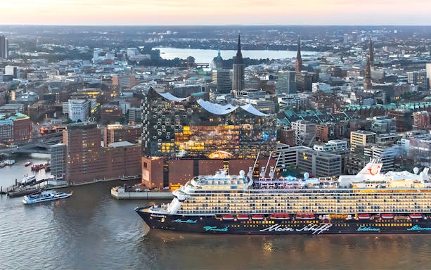 Aerial view of Elbphilharmonie and cruise ship in Hamburg, Germany at sunset.