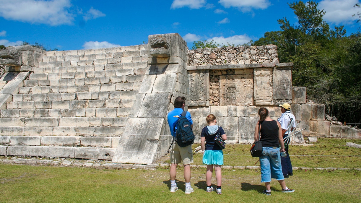 Tourists exploring the ancient ruins at Chichen Itza, Mexico.