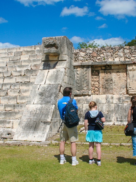 Tourists exploring the ancient ruins at Chichen Itza, Mexico.