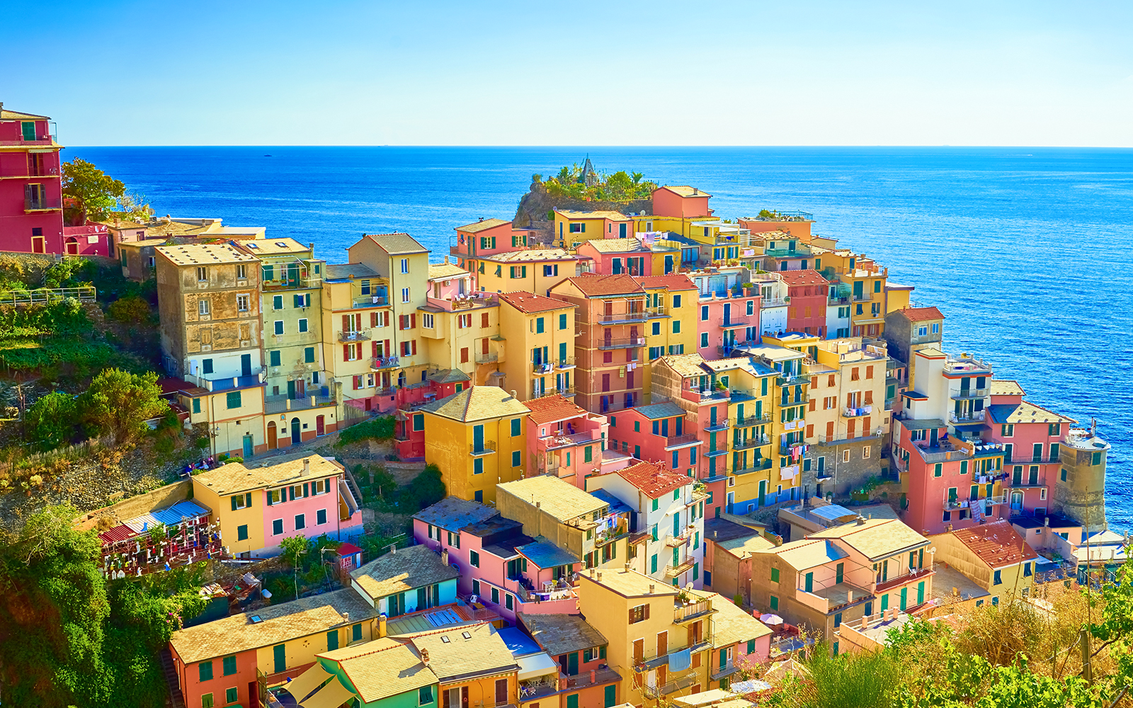 Colorful buildings in Manarola, Cinque Terre, overlooking the sea on a guided tour from Florence.