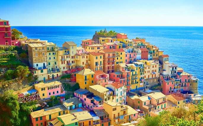 Colorful buildings in Manarola, Cinque Terre, overlooking the sea on a guided tour from Florence.