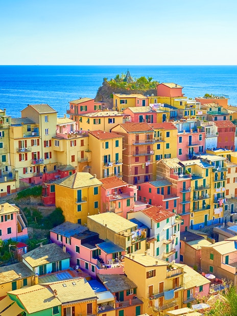 Colorful buildings in Manarola, Cinque Terre, overlooking the sea on a guided tour from Florence.