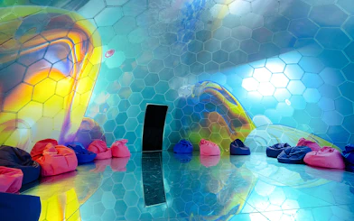 Colorful bean bags in a hexagonal room at Bubble Planet, Cologne.