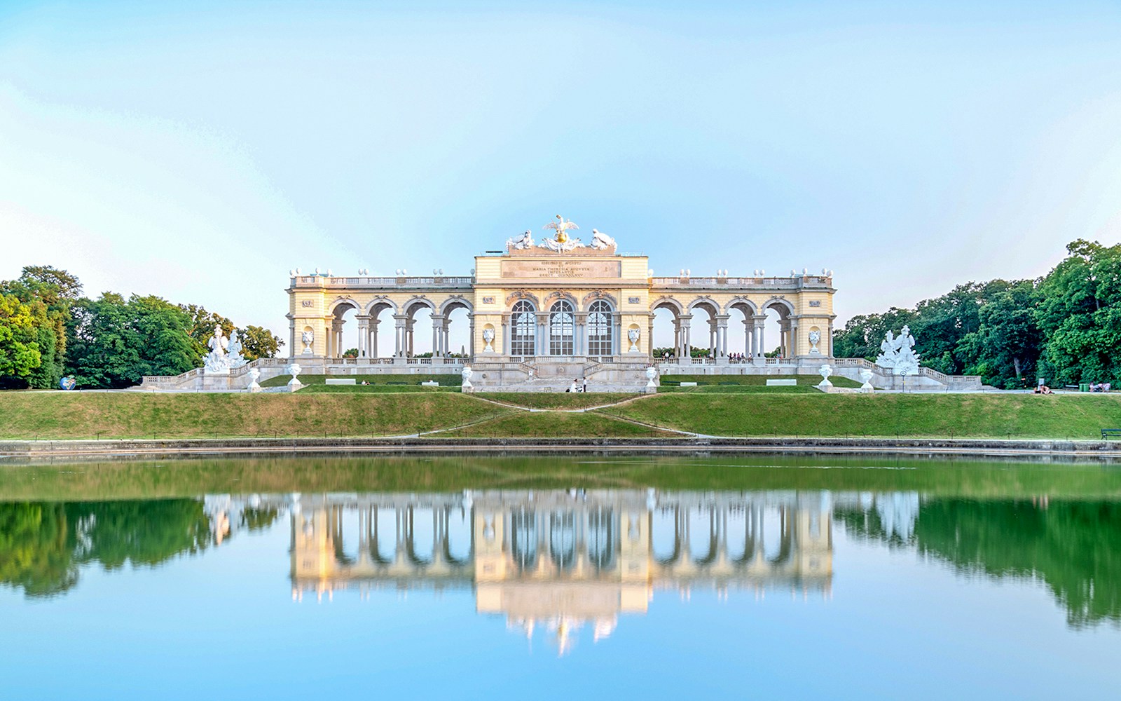 Gloriette Pavilion reflecting on a lake at Schonbrunn Palace, Vienna.