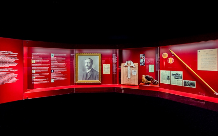 Benfica Stadium museum exhibit featuring Cosme Damião memorabilia and historical artifacts.