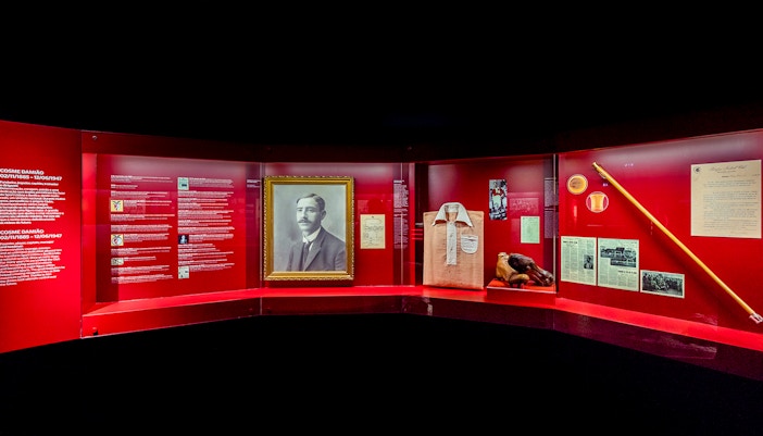 Benfica Stadium museum exhibit featuring Cosme Damião memorabilia and historical artifacts.