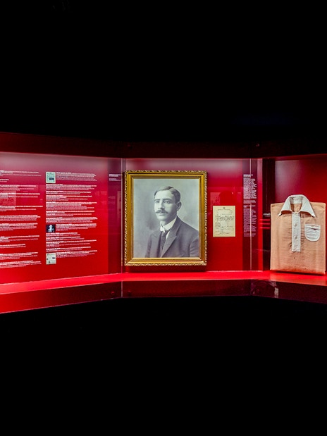 Benfica Stadium museum exhibit featuring Cosme Damião memorabilia and historical artifacts.