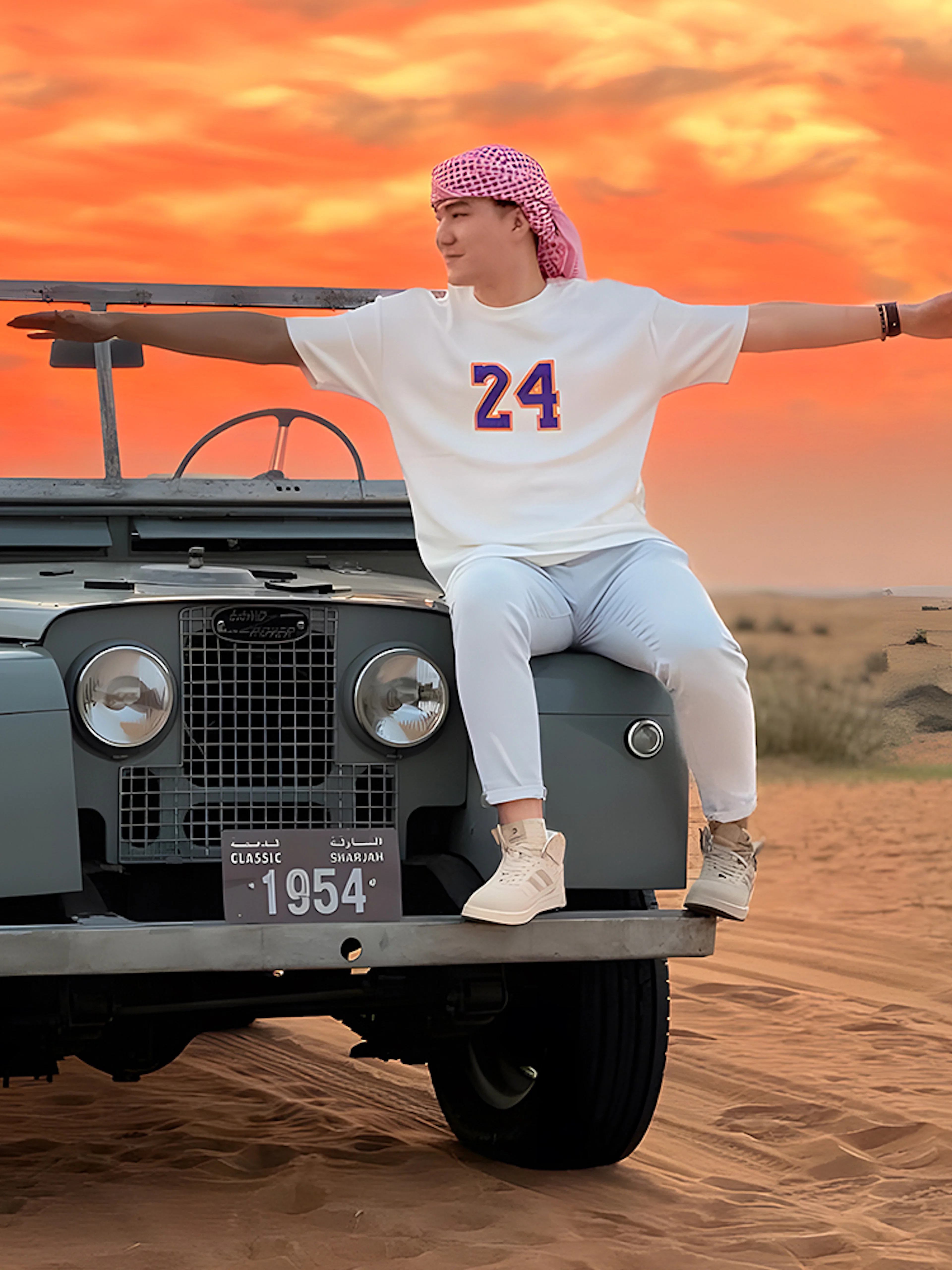 Vintage Land Rover in desert at sunset, part of hot air balloon experience.