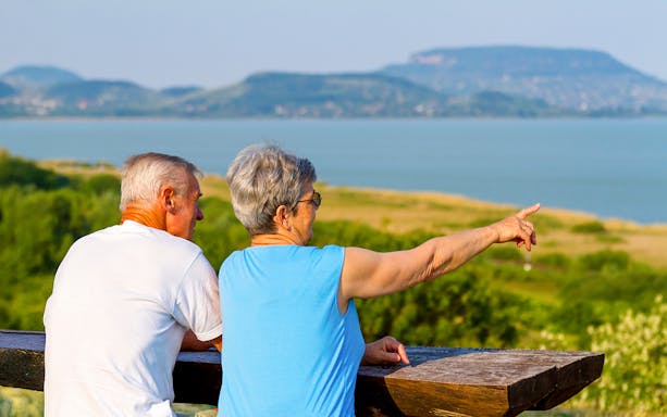 Guests admiring Lake Balaton from a scenic viewpoint.