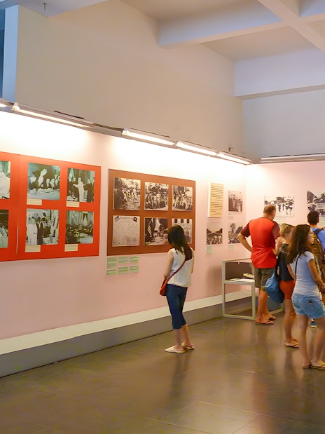 Tourists viewing exhibits at War History Museum, Ho Chi Minh City.