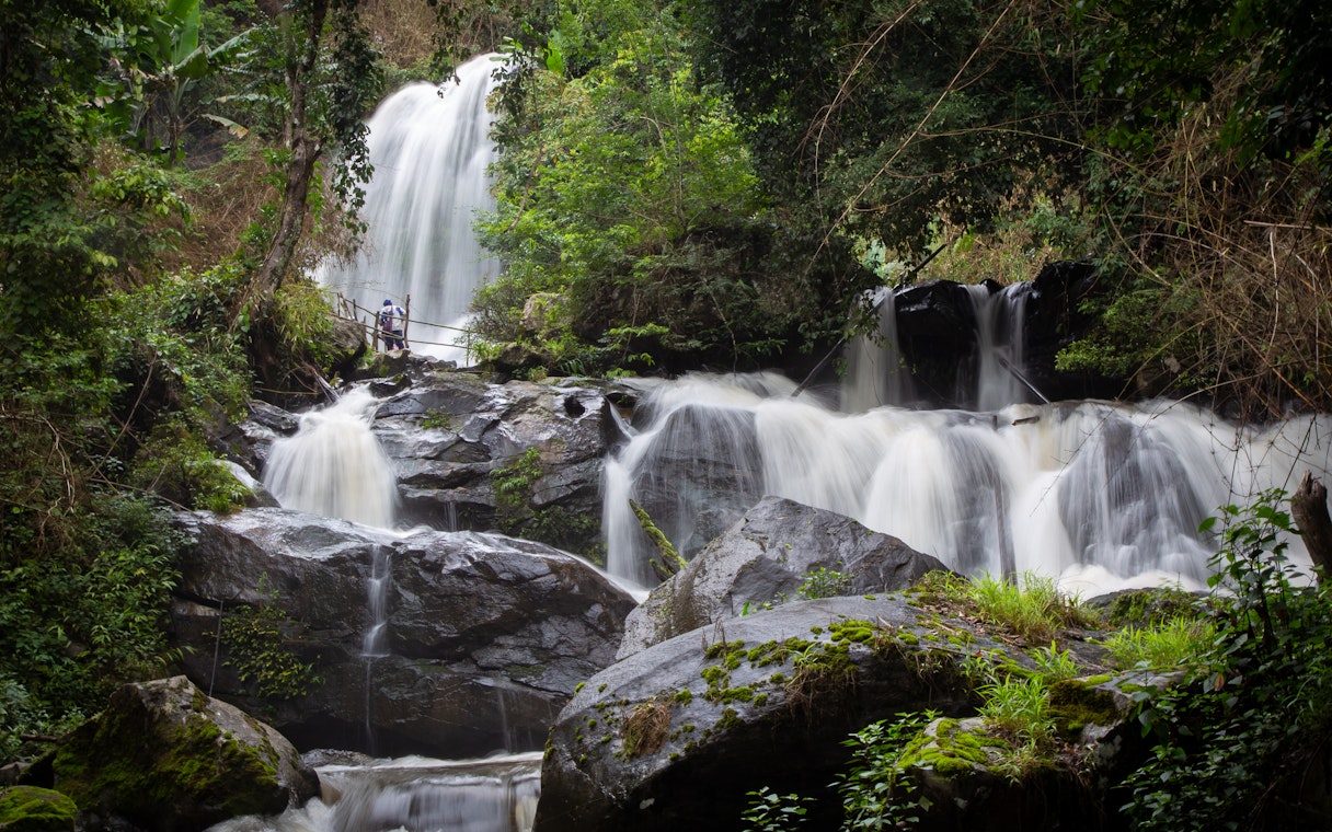 Pha Dok Siew Waterfall cascading through lush forest, Doi Inthanon National Park, Chiang Mai, Thailand.