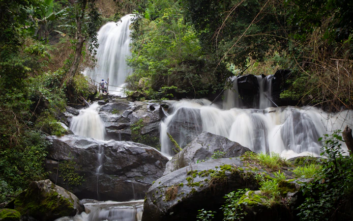 Pha Dok Siew Waterfall cascading through lush forest, Doi Inthanon National Park, Chiang Mai, Thailand.