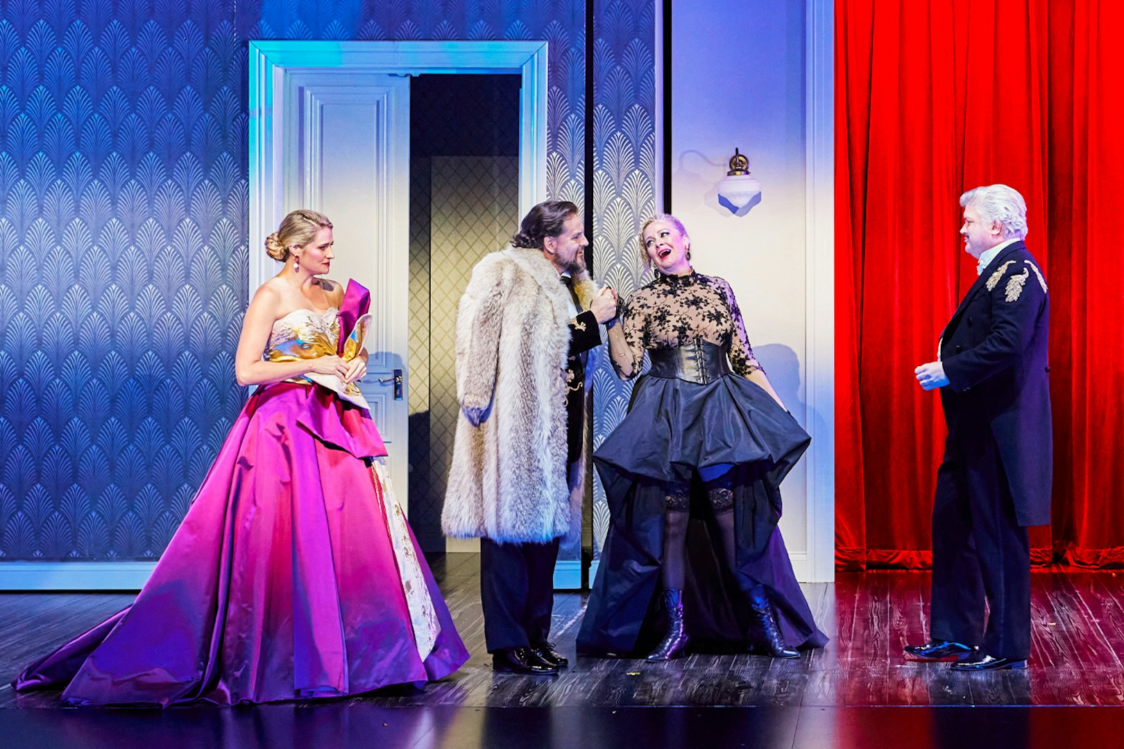 Opera performers in elegant costumes on stage at Sydney Opera House during La Traviata.