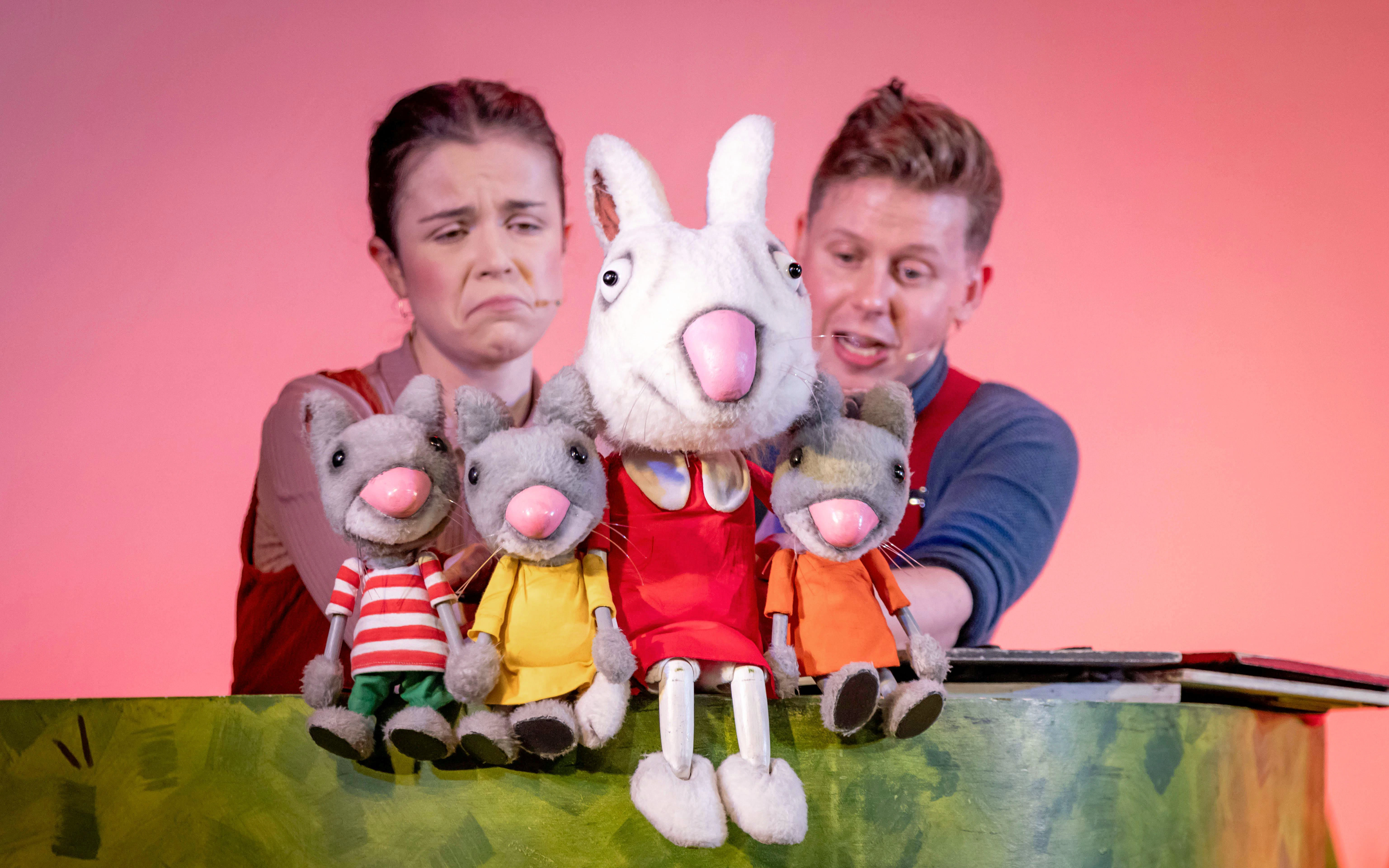 Puppeteers performing with animal puppets in "The Smartest Giant in Town" show.