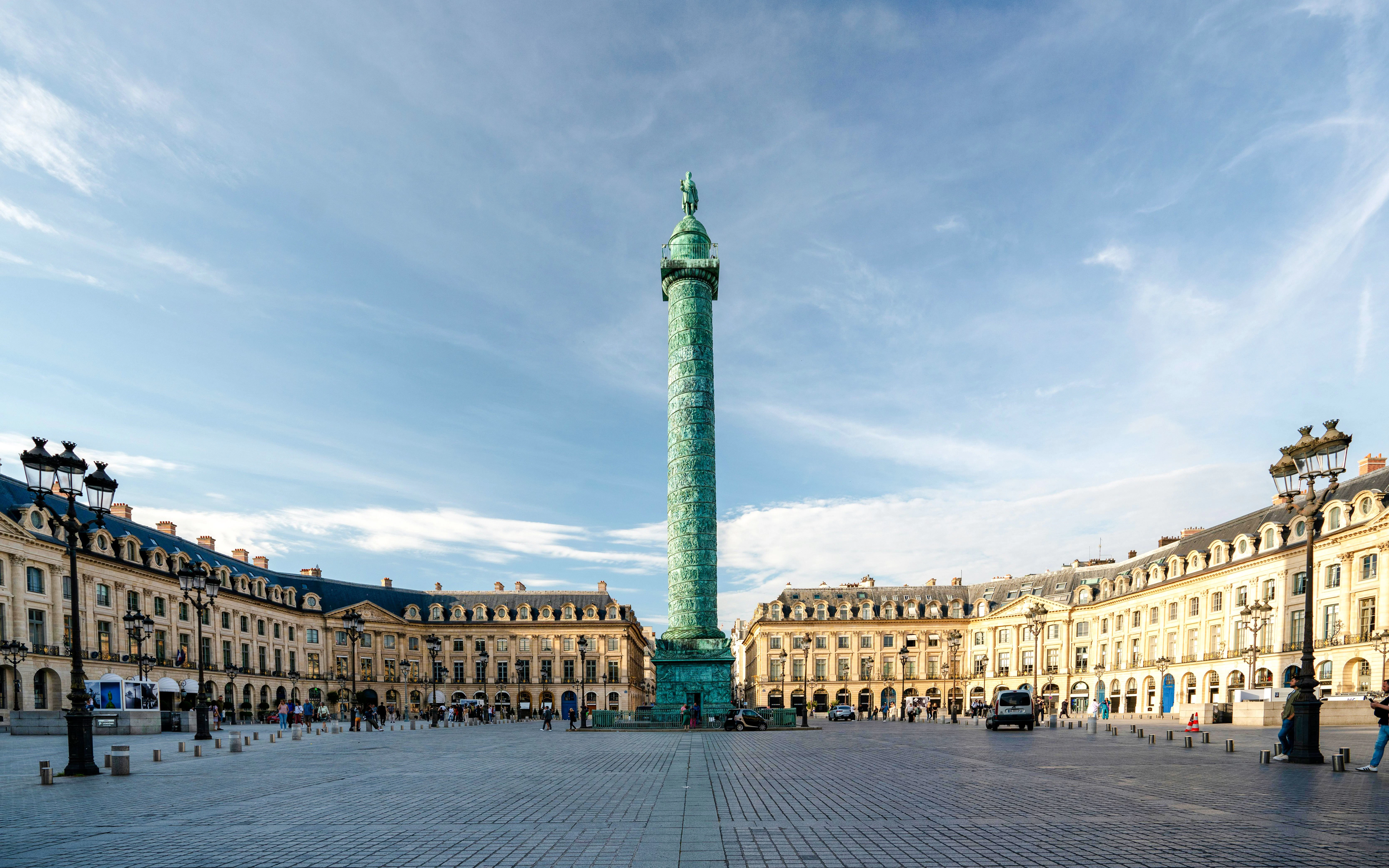 Place Vendôme with the Vendôme Column in Paris, surrounded by historic buildings.