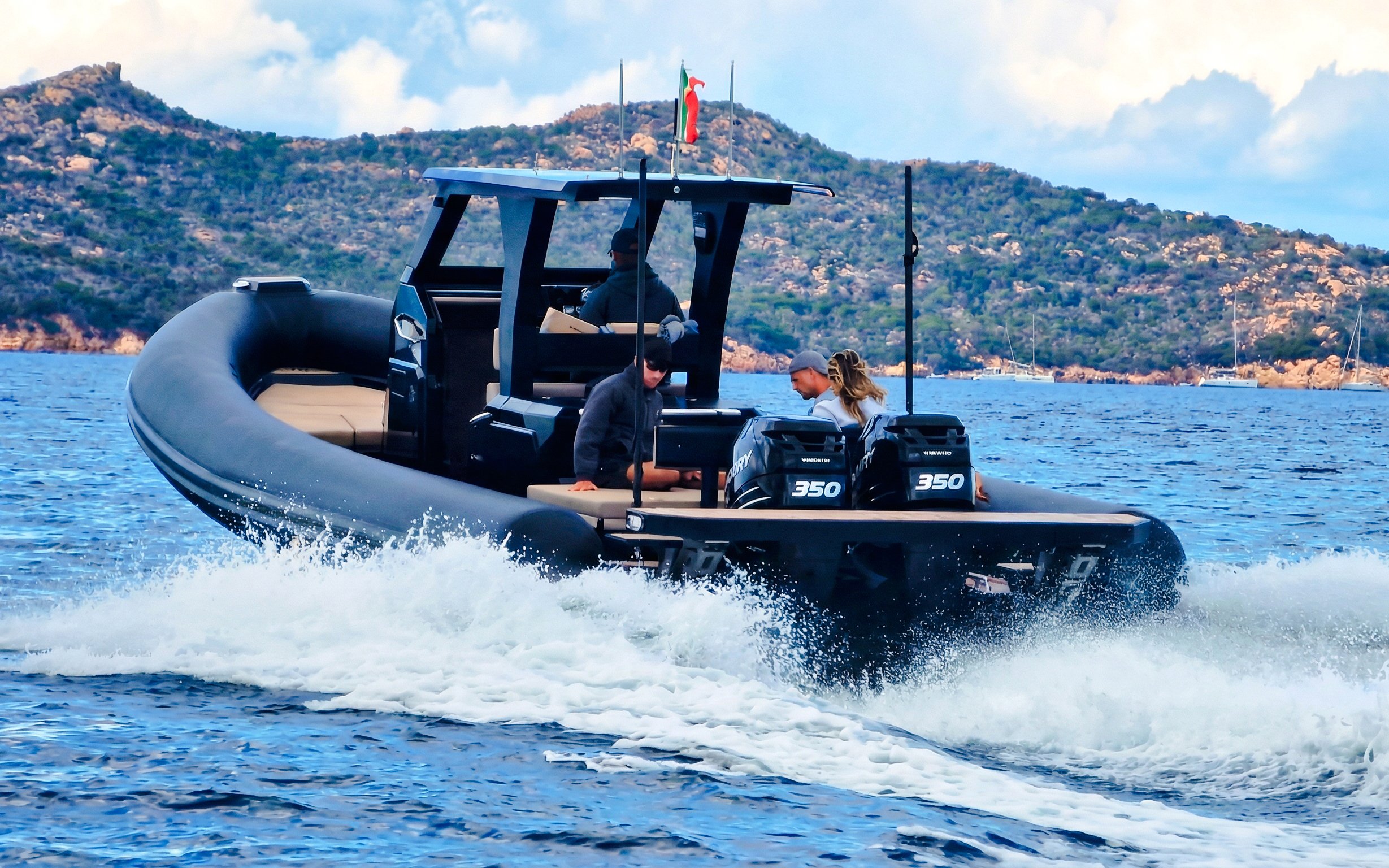 RIB boat cruising near La Maddalena Archipelago with passengers enjoying the tour.