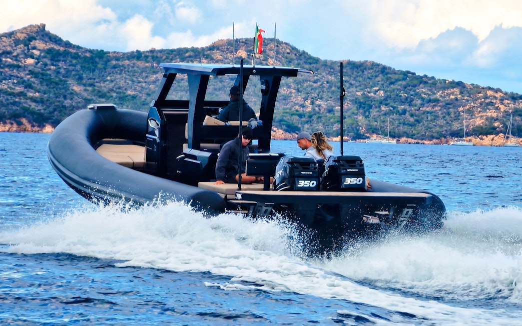 RIB boat cruising near La Maddalena Archipelago with passengers enjoying the tour.