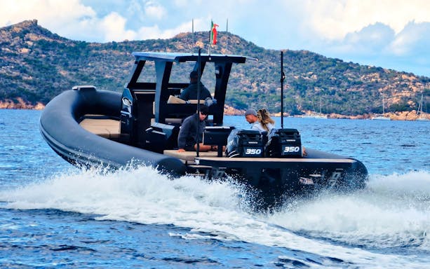 RIB boat cruising near La Maddalena Archipelago with passengers enjoying the tour.