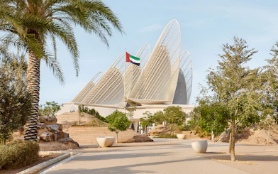 Exterior view of Zayed National Museum with unique architectural design in Abu Dhabi.