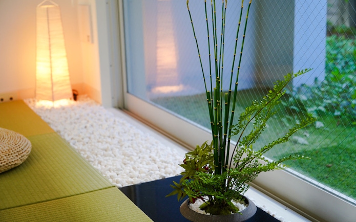 Tatami mat and bamboo arrangement in Tokyo Matcha & Kimono Experience interior.