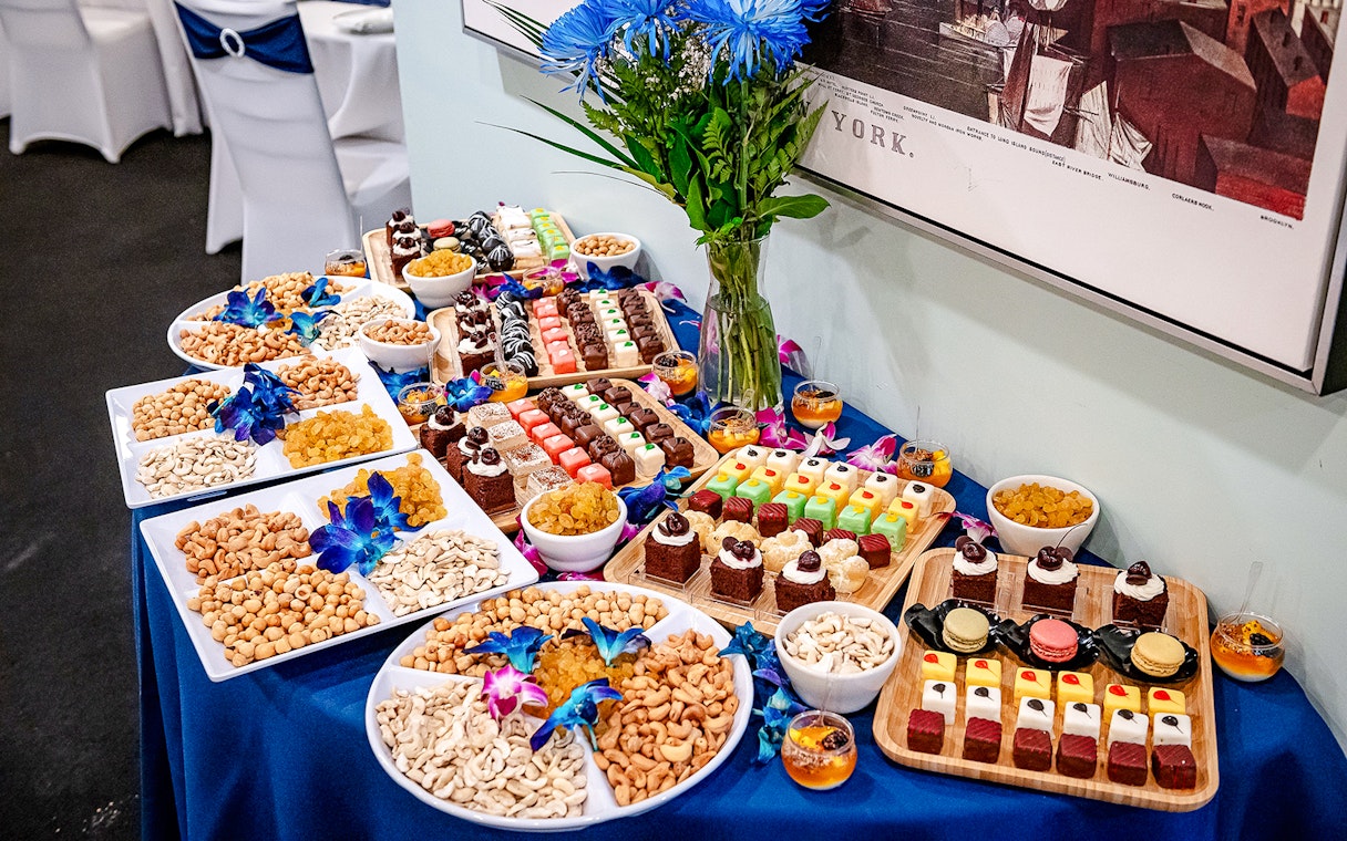 Assorted desserts and nuts on a table for New Year's Eve Dinner Cruise.