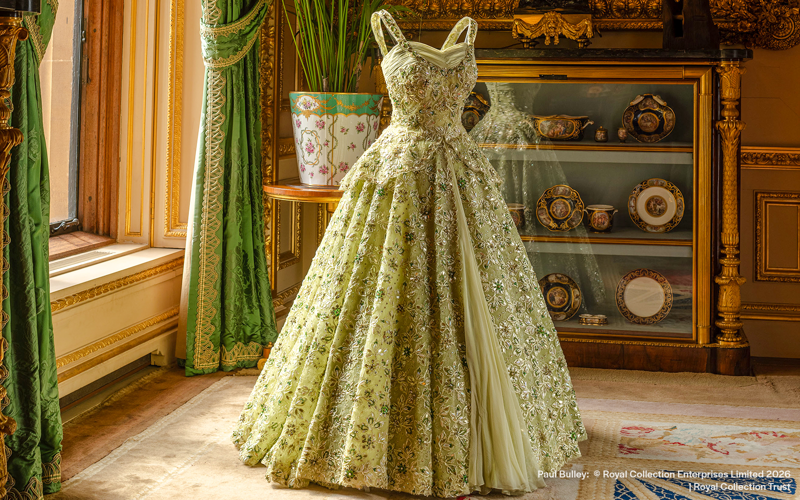 Elegant gown displayed in the Green Drawing Room at Windsor Castle.