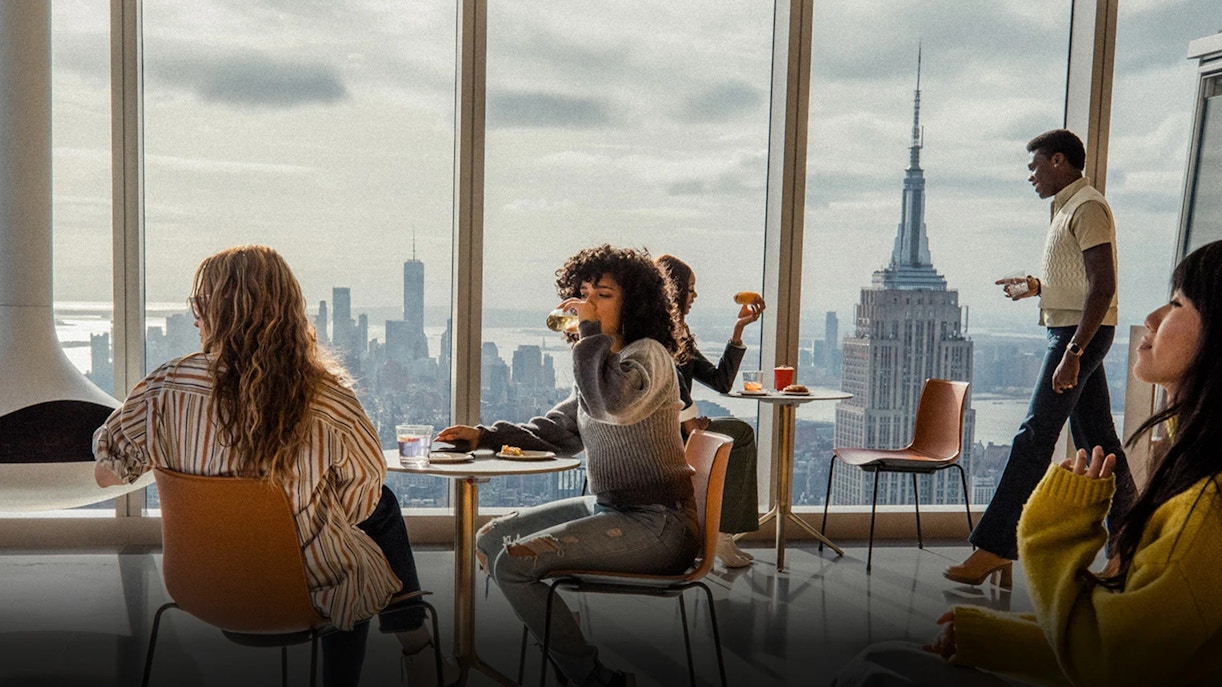 Visitors enjoying the panoramic view from SUMMIT One Vanderbilt's APRÈS lounge in New York City.