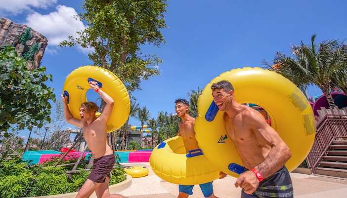 People taking inflatable rubber tubes to the slides, Andamanda Phuket
