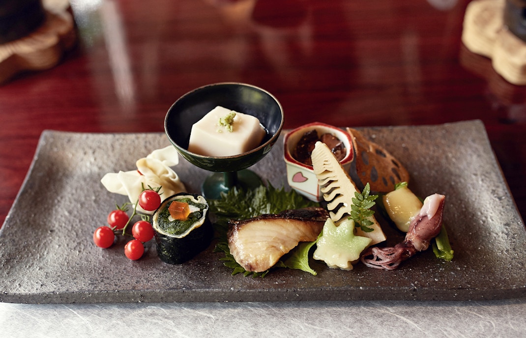 Kaiseki dinner plate with assorted traditional Japanese dishes in Kyoto.