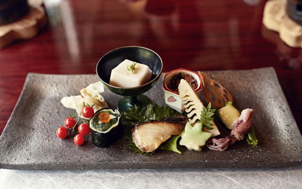 Kaiseki dinner plate with assorted traditional Japanese dishes in Kyoto.
