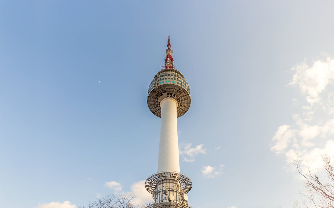 Seoul Namsan Tower against a clear blue sky.