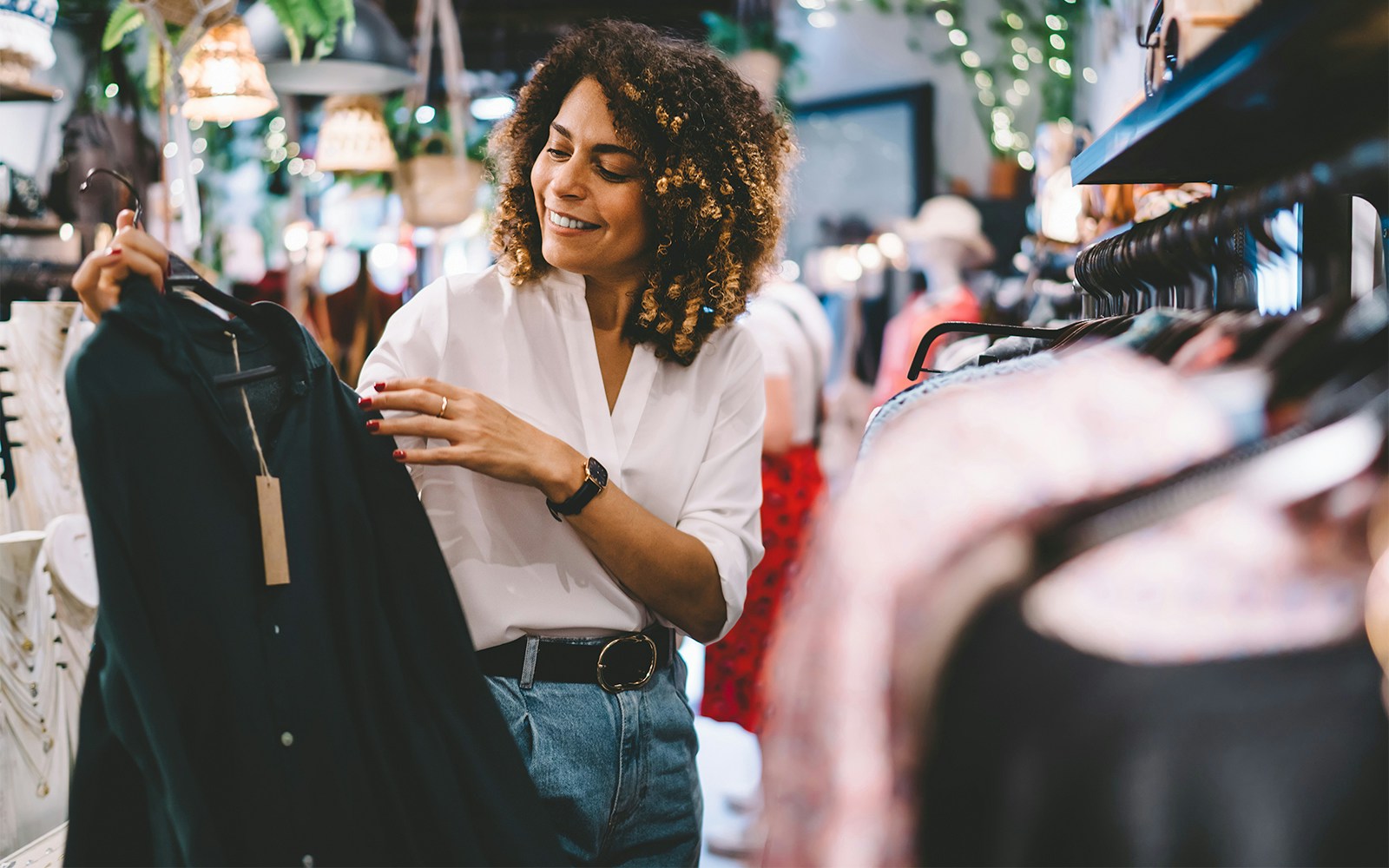 Shopper browsing clothes at Santa Cruz Premium Outlets.