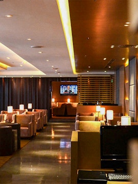 Lounge seating area with lamps at Kuala Lumpur International Airport.