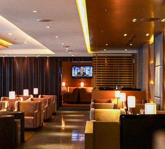 Lounge seating area with lamps at Kuala Lumpur International Airport.